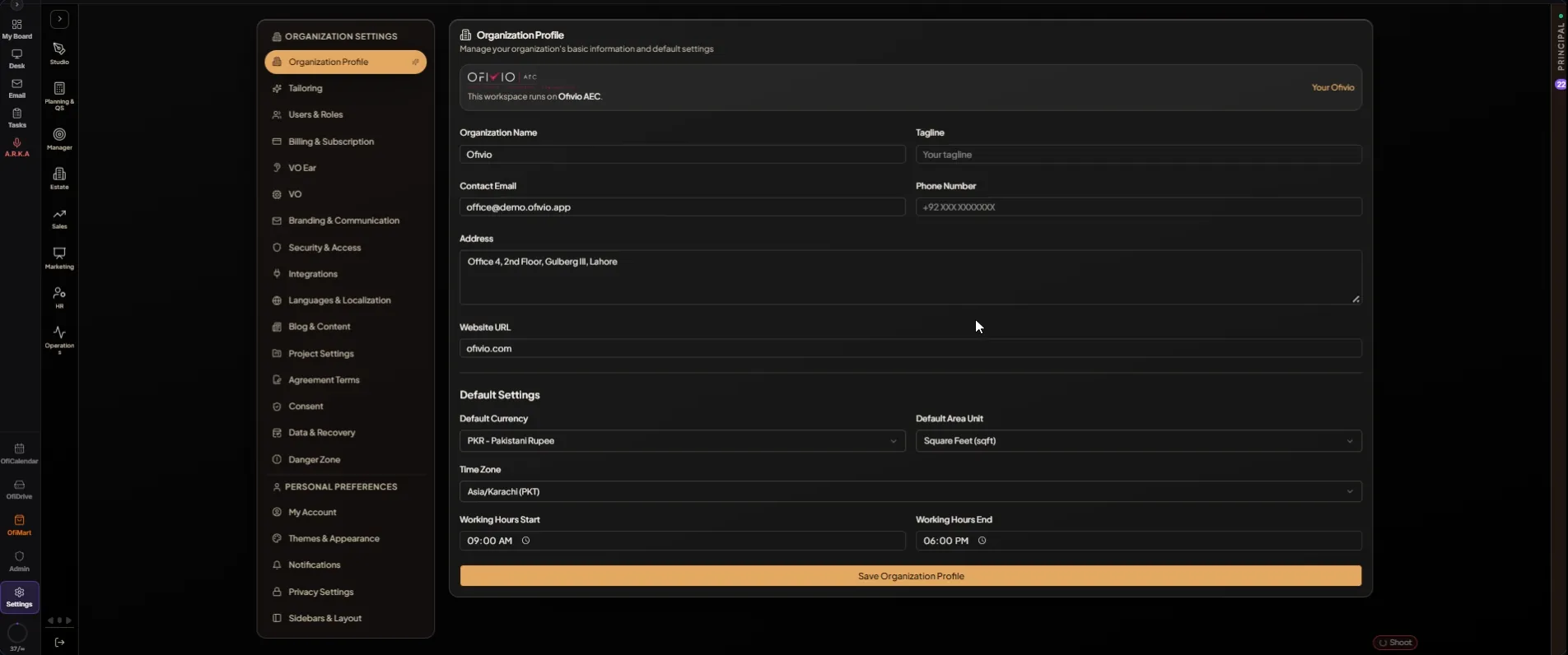 Organization Profile in the example workspace: the name, contact email and Lahore address at the top, PKR, square feet, Asia/Karachi and a 9-to-6 day under Default Settings, and the long "Save Organization Profile" button at the foot.